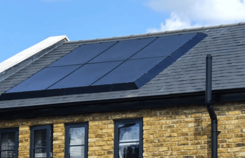 Solar panels fitted with SolaSkirt on a yellow brick house